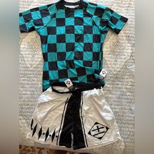 Checkered Teal and Black Shirt with White and Black Gym/Basketball Style Shorts.